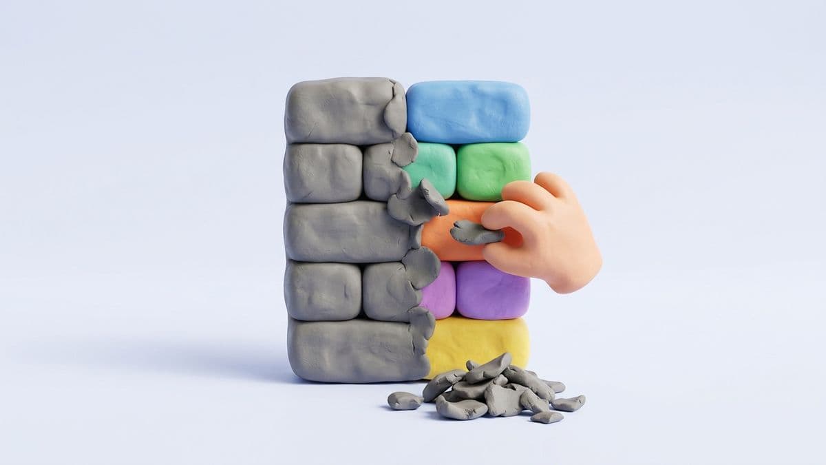 Clay article being sculpted with a small clay hand removing gray dull sections, leaving behind only colorful distinct paragraphs